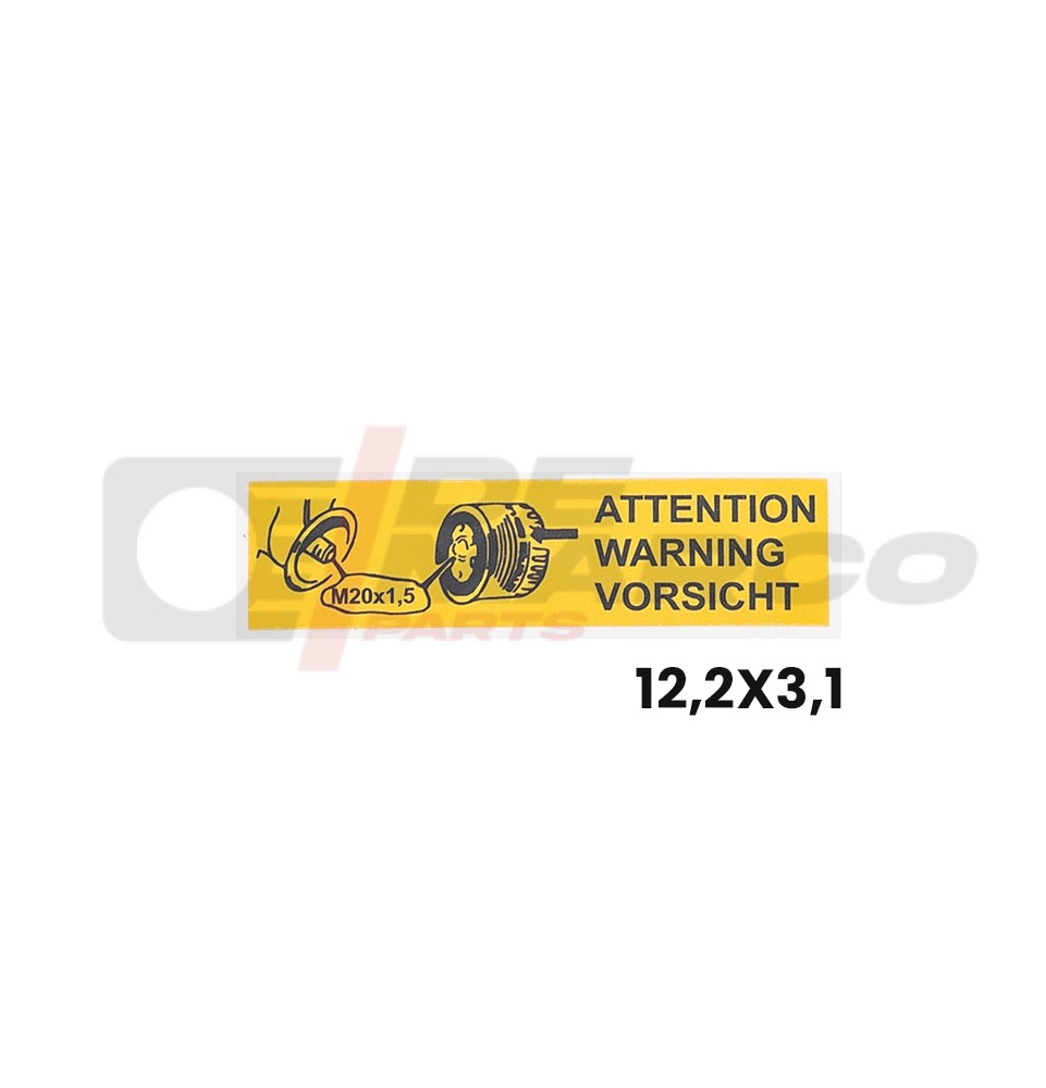 Pegatina amarilla con la palabra "Atención" en varios idiomas para utilizar en vehículos Renault antiguos.